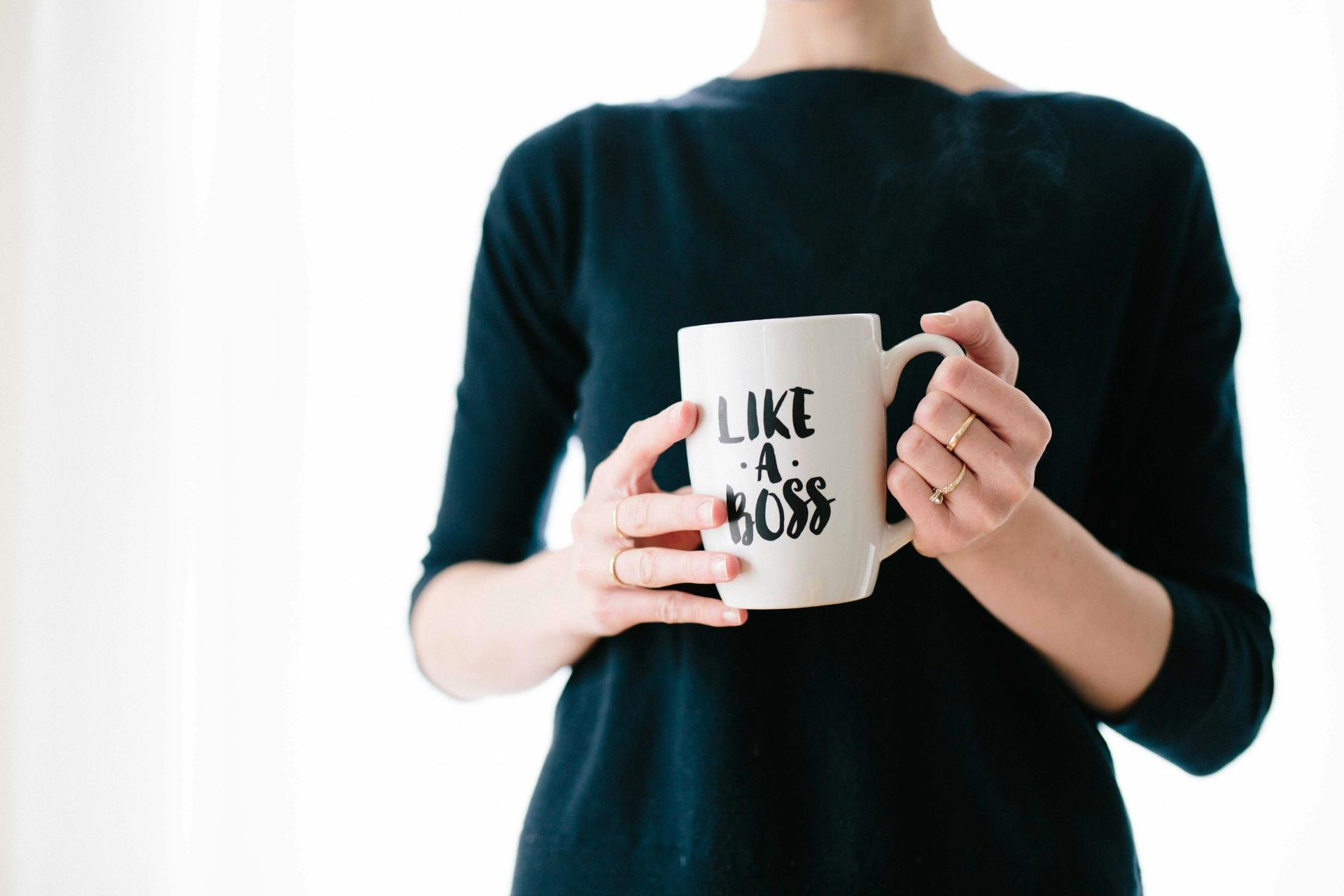 Person holding a mug